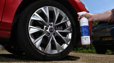 Auto Express products editor Tom Barnard cleaning a Skoda Superb's wheel with Bilt-Hamber Auto-Wheel